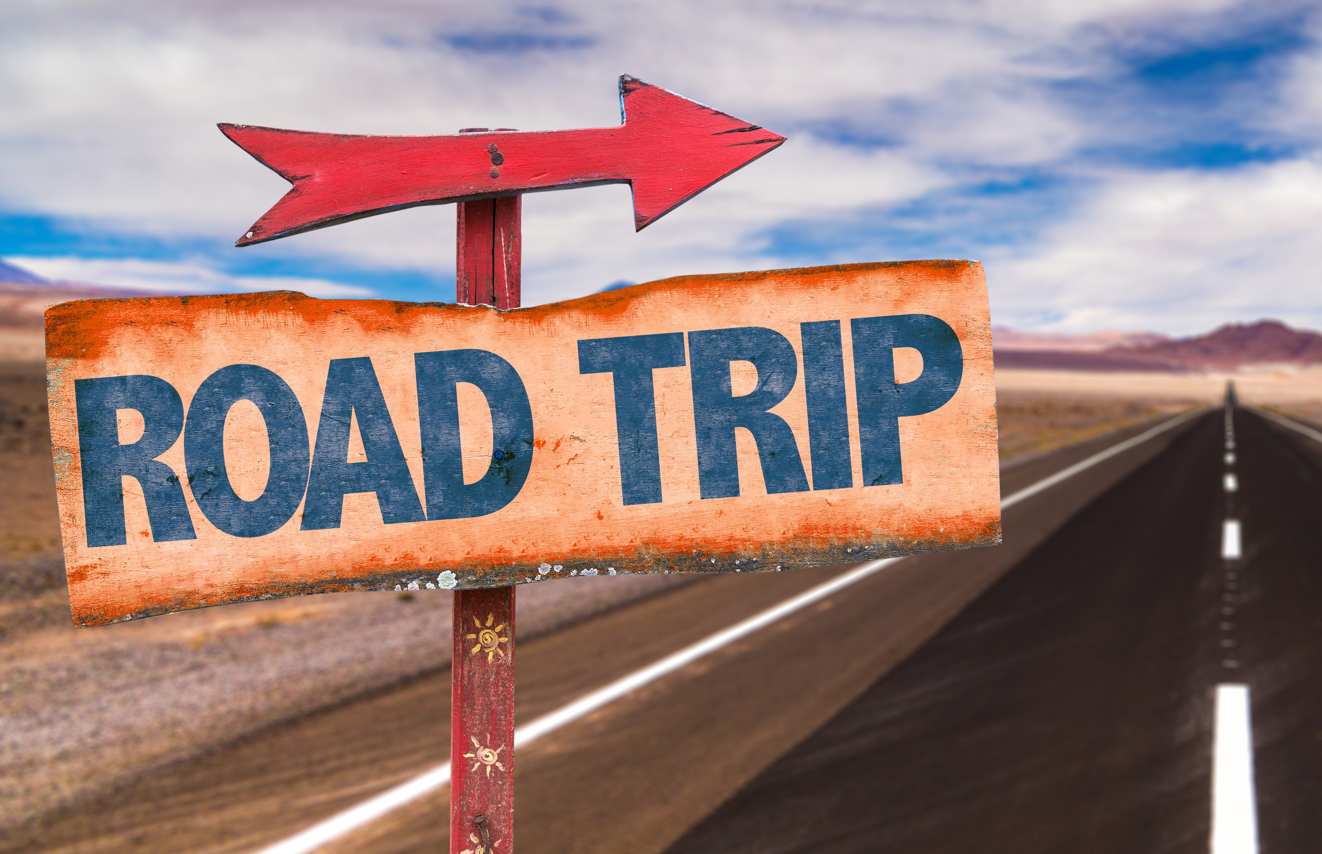 Road Trip sign with road background